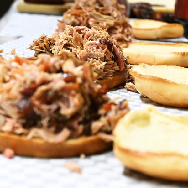 Close-up of A&R BBQ's pulled pork sandwiches on buns, ready to be served.
